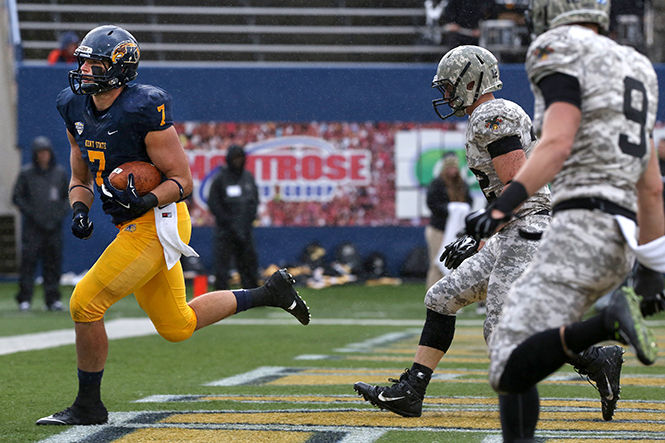 Fifth year tight end Casey Pierce scores a touchdown against Army at the homecoming game at Dix Stadium on Saturday, Oct. 18, 2014. The Flashes went on to win their first game 39-17.