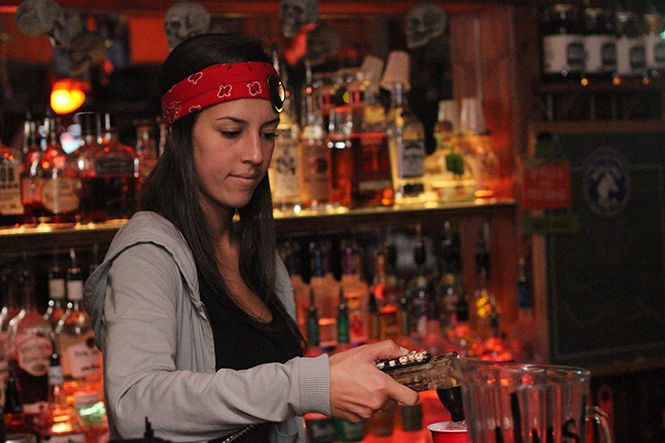 Bartender Chelsea Gehring makes a drink at the The Dusty Armadillo in Rootstown, Ohio on Oct. 29, 2014.