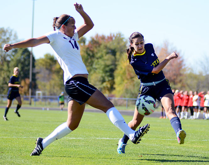 Ball State midfielder Cailey Starck blocks Kent State Stephanie Haugh Sunday, Oct. 12, 2014. The Cardinals beat the Flashes 1-0.