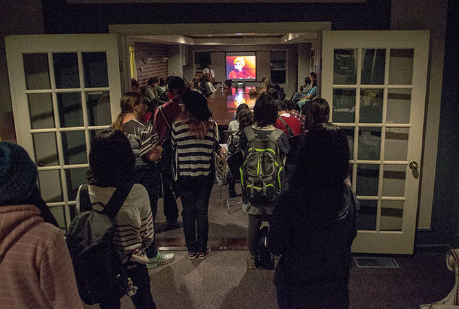 Students watch a presentation on the history and culture of Inda at KSIMs India Night in the Williamson Alumni Center on Tuesday, Sept. 30, 2014.
