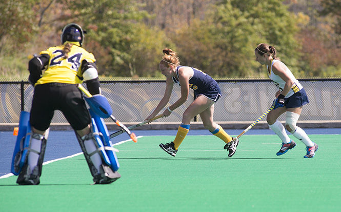 Senior foward Missy Ramsey runs to the goal during the game against Michigan on Sept. 21, 2014. The Flashes fell to the Wolverines, 3-2.