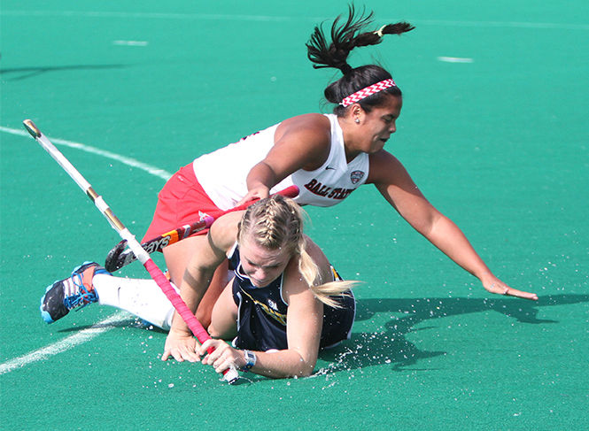 Sophomore forward Madison Thompson and Ball States Mikayla Mooney fight for the ball during Kent States 6-1 victory Saturday, Oct. 25, 2014 at Murphy-Mellis Field. The Flashes improved their record to 8-10 with the win and are undefeated in the Mid-American Conference.