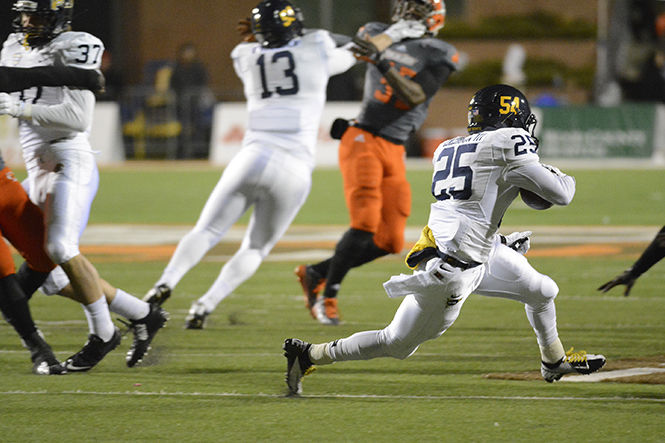 Kent State sophomore wide receiver Ernest Calhoun returns a kickoff after Bowling Green scored their second touchdown at Doyt Stadium on Wednesday, Nov. 12, 2014. The Flashes lost the game 30-20 bringing their record to 1-9.