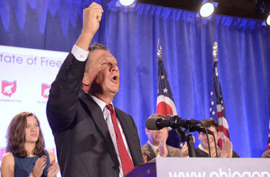 Governor John Kasich celebrates his reelection with a roaring crowd at the Ohio GOP watch party in Columbus on Tuesday, Nov. 4, 2014.