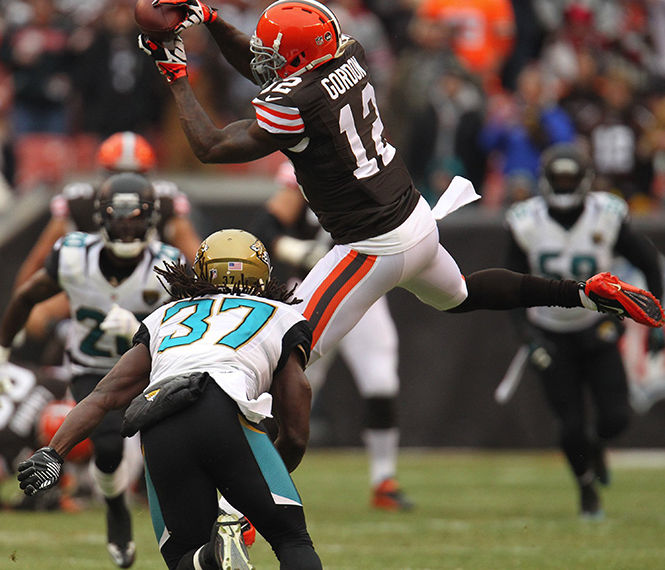 Cleveland wide receiver Josh Gordon, right, grabs a pass in front of Jacksonville safety Johnathan Cyprien at FirstEnergy Stadium on Sunday, Dec. 1, 2013, in Cleveland, Ohio. The Jaguars defeated the Browns, 32-28.