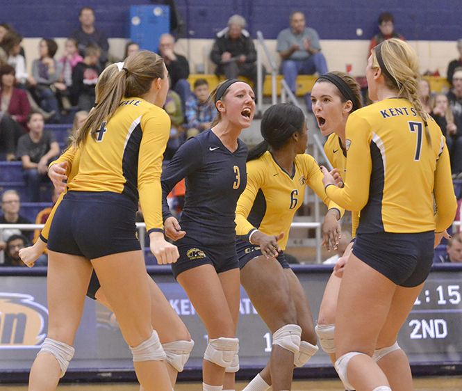 Kent States volleyball team cheers each other on during the game against MAC opponent Ohio University on Thursday, Oct. 30, 2014. The Flashes lost the game, 3-1.