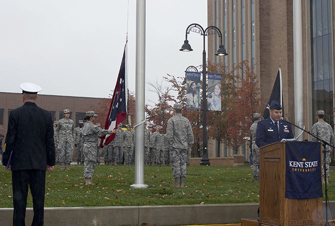 Lieutenant Colonel Daniel Finkelstein begins the annual Veterans Day observance Thursday, Nov. 6, 2014 as the Kent State ROTC raises the Ohio flag.