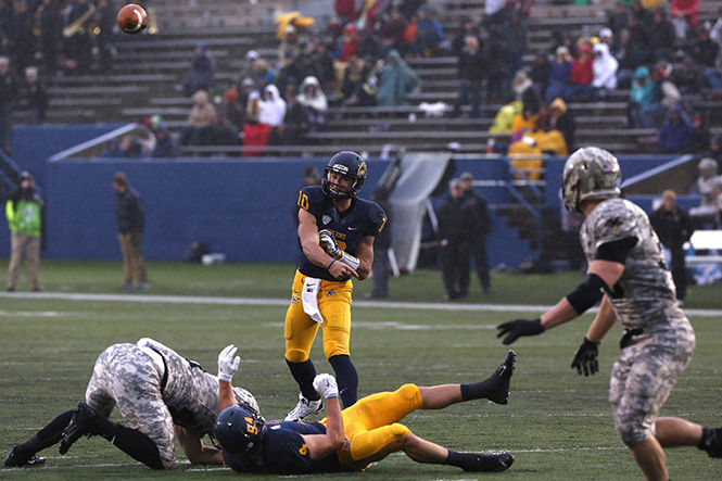 Sophomore quarterback Colin Reardon makes a play against Army at the Homecoming Game Saturday, Oct. 17, 2014. The Flashes are 1-7 in their season and face the University of Toledo on Tuesday at 8p.m.