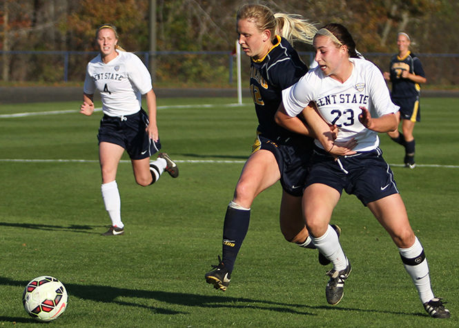 Kent States Jenna Hellstrom gets tangled up with Toledos Gabby Epelman while chasing after the ball during a game Friday, Oct. 24, 2014. The Flashes won 3-0.