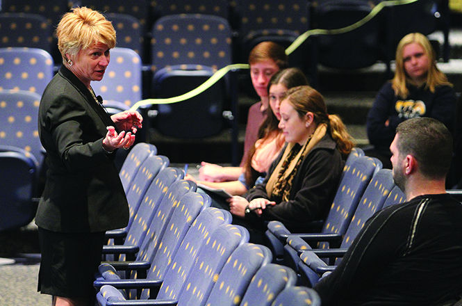 Kent State President Beverly Warren talks with students during her Listening Tour in the Kiva Thursday, Nov. 13, 2014. Warren wanted to find out what Kent State means to students and what needs to improve.