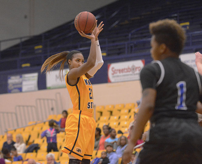 Junior guard Melanee Stubbs takes a shot during an exhibition against Ohio Christian University on Friday, Nov. 7, 2014. The Flashes won, 100-45.