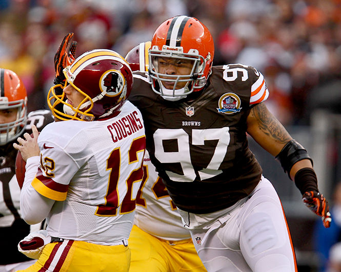 Cleveland Browns Jabaal Sheard sacks Washington Redskins quarterback Kirk Cousins in the first quarter at Cleveland Browns Stadium on Sunday, December 16, 2012, in Cleveland, Ohio. The Washington Redskins defeated the Cleveland Browns, 38-21.