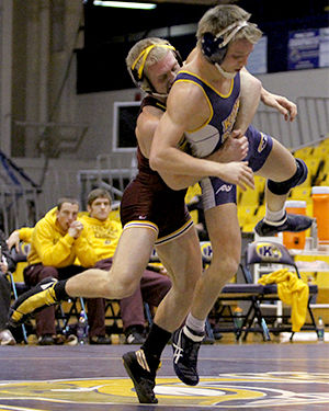 The Kent Stater Central Michigans Joe Roth throws Kent States Mack McGuire to the mat during their match in the M.A.C. Center on Sunday, Jan. 26, 2014.