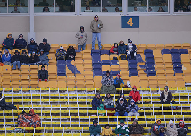 Fans endure the cold at the Wagon Wheel against Akron on Friday, Nov. 28, 2014 at Dix Stadium. The Flashes defeated the Zips, 27-24.