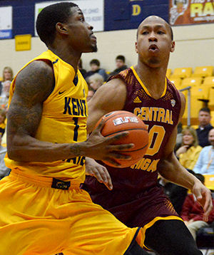 Kris Brewer attempts to make a pass at the game against Central Michigan on Tuesday Jan. 27th, 2015. The Flashes won 63-53.