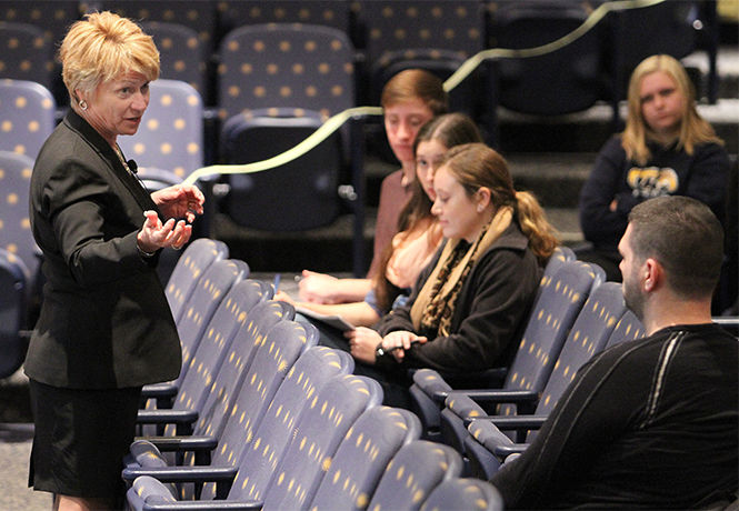 Kent State President Beverly Warren talks with students during her Listening Tour in the Kiva on Thursday, Nov. 13, 2014. Warren wanted to find out what Kent State University means to students and what students think needs to improve.