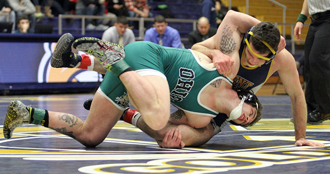 Kent States Mike Vollant tries to keep Ohios Cody Walters close to the mat during their wrestling meet in the M.A.C. Center on Friday, Jan. 16, 2015.