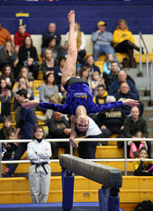 Sophomore Milena Fabry competes on the balance beam at the first home meet of the season against Western Michigan on Friday, Jan. 23, 2015 in the M.A.C. Center. The Flashes pulled a 194.900-193.325 win over the Broncos.