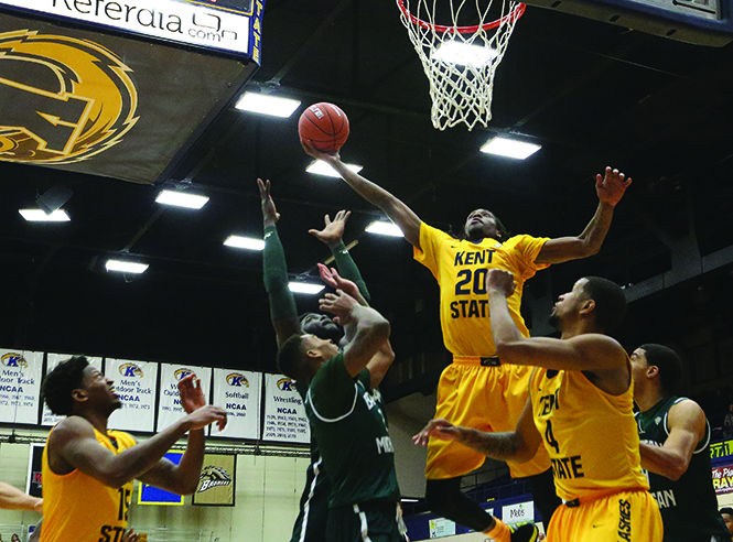 Sophomore forward Marquiez Lawrence jumps for a ball in the game against Eastern Michigan at the M.A.C. Center on Wednesday, Jan. 14, 2014. The Flashes won 65-59.