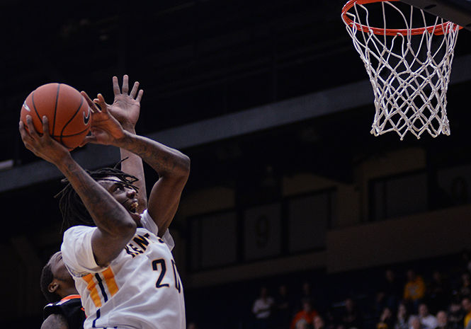 Kent State sophomore forward Marquiez Lawrence goes up for a basket during the MAC opener game against Bowling Green on Wednesday, Jan. 7, 2015. The Flashes lost the game 64-66.