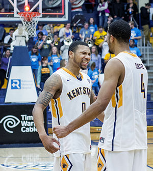 Senior guard Devareaux Manley celebrates Kent States 61-60 thrilling win over Miami with teamate Chris Ortiz in the M.A.C. Center, on Saturday, Feb. 7, 2015. Ortiz threw down a dunk for the win with 42 seconds left, bringing Kents record to 16-7 overall and 7-3 in the MAC East division, a dead tie for first place with rivals Akron University.
