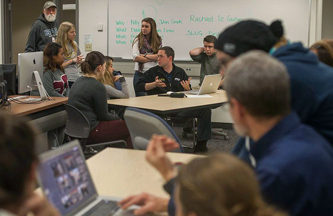 Bruce Zake and Scott Galving help photojournalism students learn how to develop a workflow at the FocalPoint meeting Thursday, Nov. 6, 2014.