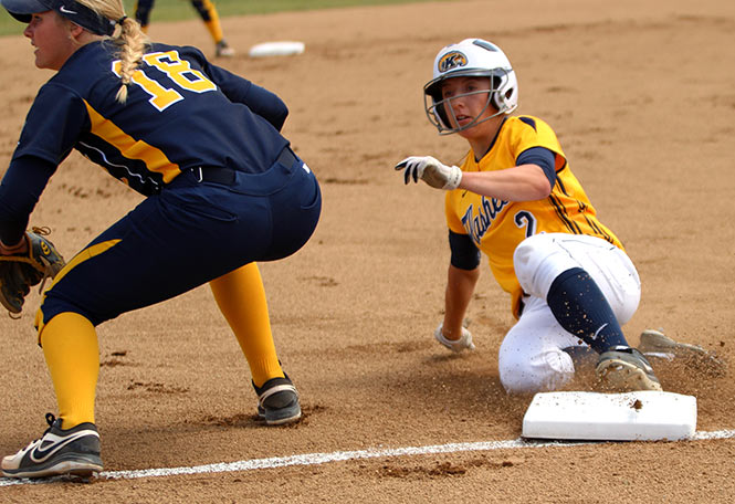 Kent+State+softball+outfielder+Kim+Kirkpatrick+steals+third+base+in+first+game+against+Toledo+in+a+double-header+Friday%2C+April+18%2C+2014.+The+Flashes+won+13-0+the+first+game+and+1-0+the+second+game.