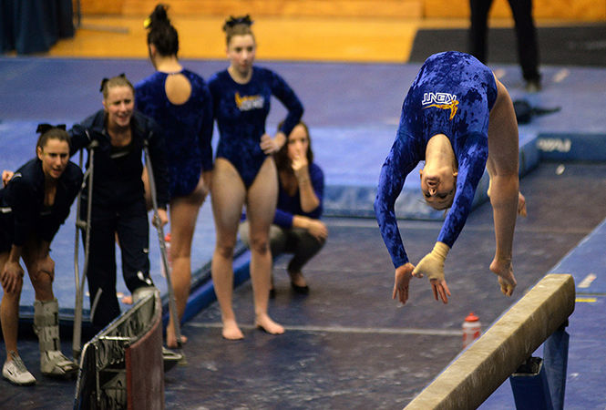 Rachel Stypinski performs her routine on the balance beam during the first home meet of the season against Western Michigan on Friday, Jan. 23. Stypinski finished her routine with a final score of 9.875 to win this event as well as the floor routine. The Flashes defeated the Broncos with an overall final score of 194.900-193.325.