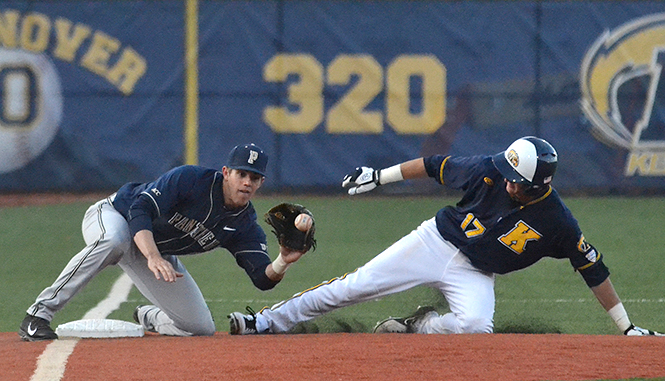 Sophomore infielder Justin Wagler (right) slides into third base at Wednesdays baseball game against University of Pittsburgh, April 16, 2014. Kent State won the game, 4-1.