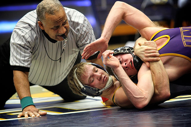  Kent State Junior Mack McGuire wrestles his opponent Leighton Gaul of Northern Iowa on Sunday Feb. 8, 2015. McGuire won by decision 4-1.