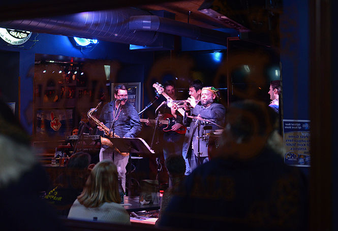 Kent-based band Costley Ct. performs funk tunes for Mardi Gras at Water Street Tavern on Tuesday, Feb. 17, 2015.