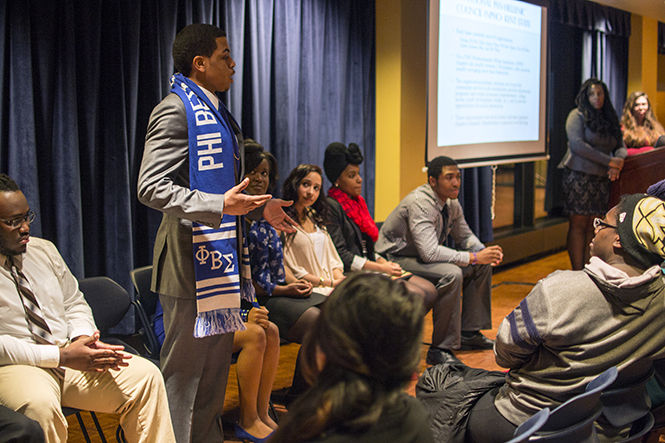 Junior political science major Camara Thomas introduces himself and explains why he joined his fraternity Phi Beta Sigma at the Multicultural Greek Info Night on Wednesday, Feb. 4, 2015. “I wanted to look out for those around me and I felt Phi Beta Sigma gave me that opportunity,” Thomas said.