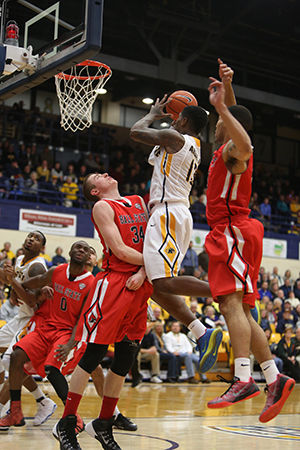 The Kent Stater Kent State Forward Junior Gary Akbar makes a layup in the game against Ball State on Wednesday, Feb. 18, 2015. Kent State defeated Ball State 58-53 at the M.A.C. Center.