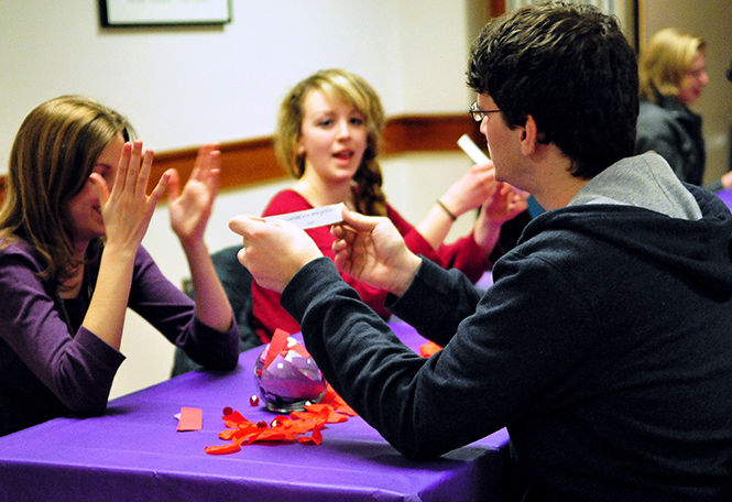 Michelle Flynn and Nina Kern react to a funny question during a speed dating event in the Kent State Student Center.