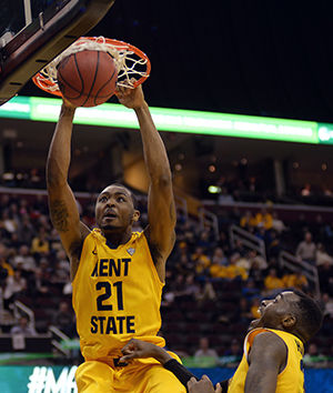 Junior forward Khaliq Spicer dunks the ball during the first half of the MAC Tournament game against the University of Akron on Thursday, March 12, 2015.