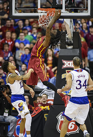 Iowa State's Jameel McKay (1) dunks over Kansas' Kelly Oubre Jr. (12) in the finals of the Big 12 Tournament at the Sprint Center in Kansas City, Mo., on Saturday, March 14, 2015. Iowa State won, 70-66.
