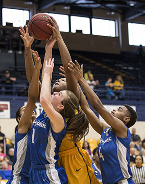 Senior forward Monita Johnson takes a shot during the first half of the game against the University of Buffalo at the M.A.C Center on March 7, 2015. The team lost to Buffalo 68 to 58 in their last game of the season to end with an overall record of 5-24.