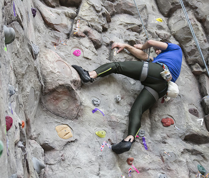 Verne+Homscher%2C+a+graduate+of+The+University+of+Akron%2C+climbs+the+35-foot+rock+climbing+wall+at+the+Rec+Center+on+March+10%2C+2015.