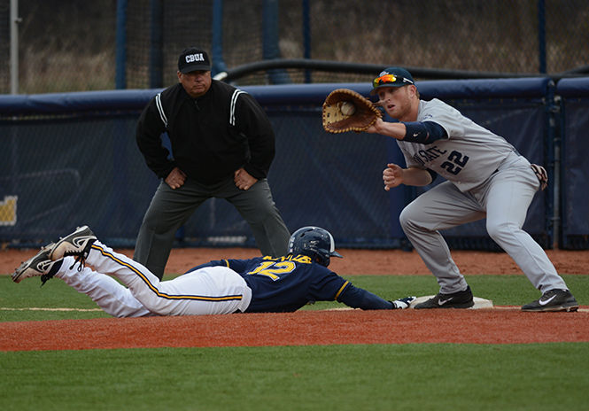 Alex Miklos, junior out-fielder for Kent State is called safe after making a dive for second base after attempting to steal during the baseball game against Penn State on April 22nd, 2014.