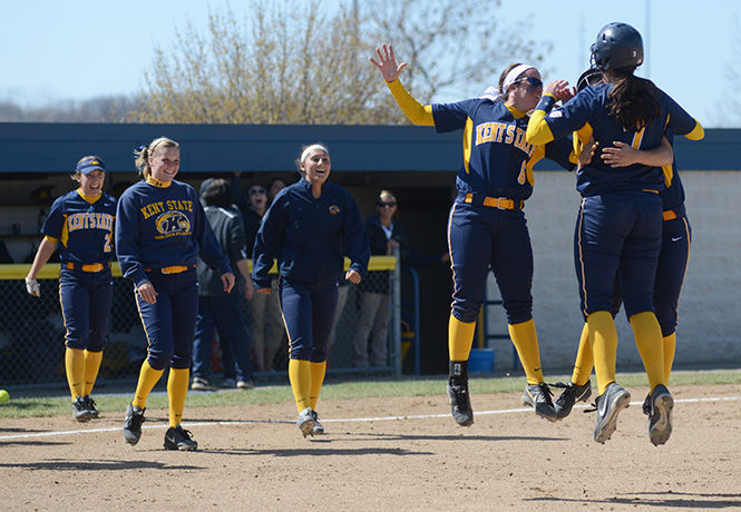 MELANIE NESTERUK Members of Kent State's softball team celebrate over a victory against Bowling Green on April 9, 2014.