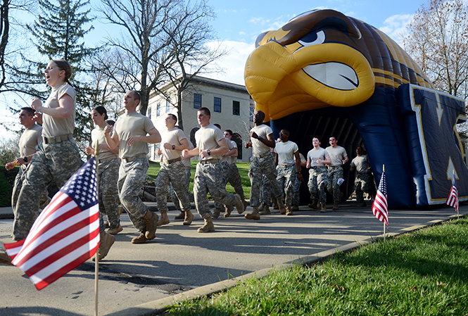 ROTC cadets approach the finish line at The WhiteHot 5K race across the Kent State campus Saturday, April 26, 2014. The race honors former fallen ROTC soldier Ashley White, who was killed in Afghanistan in October of 2011. The money raised from the race goes into a scholarship fund bearing Ashley’s name that benefits ROTC Cadets at Kent.
