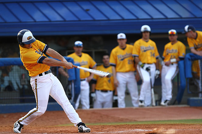 Kent State Senior Troy Summers taking a big cut during the second game of a doubleheader against Oakland. The Flashes went on to win 16-1, Tuesday, April 1, 2014.