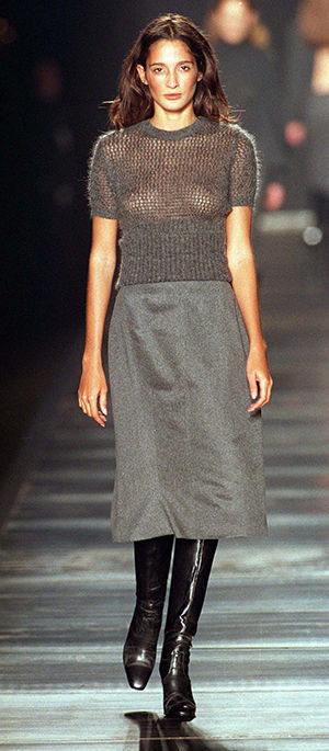 A model wears a sheer grey sweater with a grey skirt during the showing of the 1998 John Bartlett fall and winter collection during fashion week in Milan, Italy. (This photo may contain offensive content for some readers)