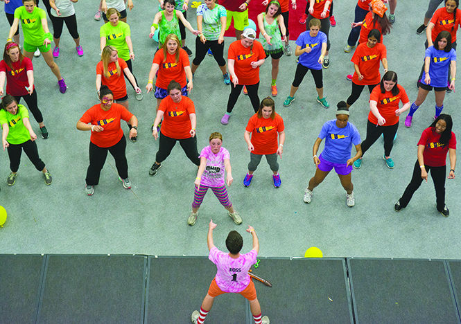 A student from Ohio University leads others in zumba during Flash-a-thon in the Student Recreation and Wellness center on Saturday night, April 25, 2015. This year the annual 12-hour dance party helped raise $37,784 for the kids at the Akron Children’s Hospital.