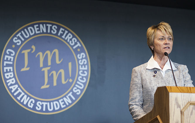 President Beverly Warren speaks at the grand opening of the Center for Undergraduate Excellence on April 28, 2015. Students first is my number one priority, said Warren. Im in on this experience, she said, referring to the sign behind her. Im in on the students that make up this wonderful university.