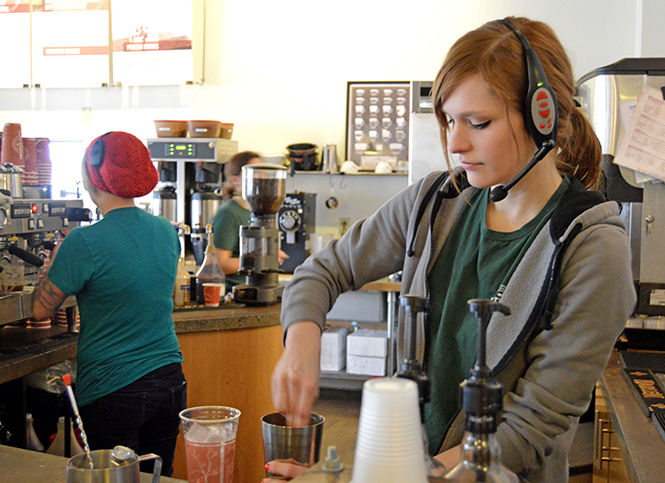 Barista Astrid Klingenberg prepares a drink Monday morning on April 6, 2015, at Tree City Coffee and Pastry in Kent, Ohio. Tree City has a wide variety of baked goods and beverages for customers to choose from.