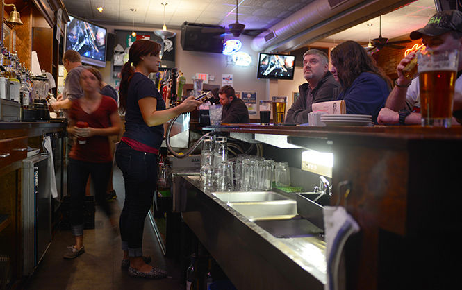 The Rays staff keeps busy behind the bar on Tuesday night during the Indians vs. Padres game on April 8, 2014.