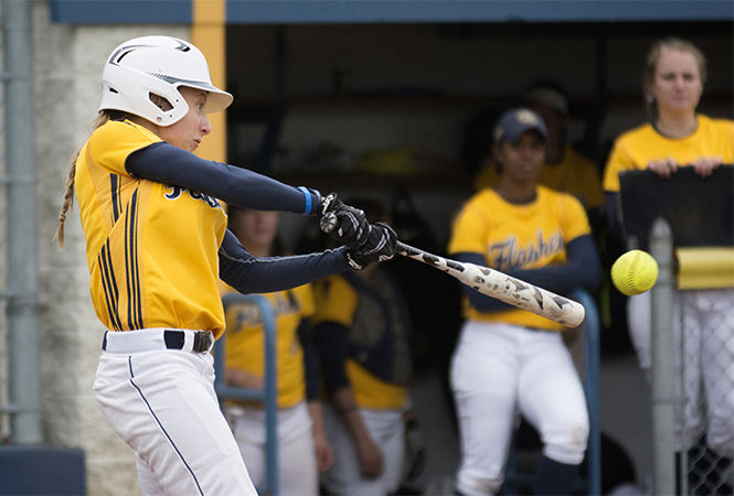 Senior outfielder Kim Kirkpatrick hits a ball foul during the first game of Kent State’s double header against Cleveland State at the Diamond at Dix on Tuesday, April 14, 2015.