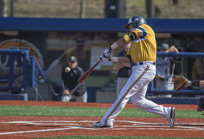 Catcher Tim DalPorto gets a hit during Kent States 5-4 win over Oakland University at Schoonover Stadium on Tuesday, April 28, 2015. The Flashes lost the second game against Oakland, 4-3, dropping their record to 24-18 overall.