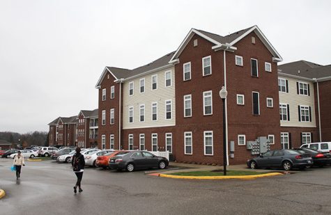 Students walk around the Province apartment complex on Tuesday, April 7, 2015.